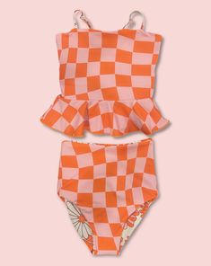 This darling tankini is basically four swimsuits in one (see the variations below). We tested the fabrics in the salty ocean, sandy beaches, pools, and hot-tubs. It is high-quality, comfortable, and SO much fun!! Truly, a combination your littles won't want to live (or swim) without ;). High-waisted reversible bottoms Peplum top Adjustable back straps High-quality double fabric Fits true-to-size Rad Swim, Crochet Tankini, Cute One Piece Swimsuits, Printed Peplum Top, Swimming Suits, Girls Swimwear, Modest Swimsuits, Swimming Swimsuit, Floral One Piece