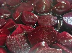 beets are being cooked in a pot on the stove