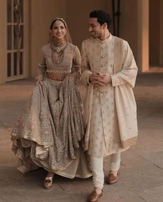 Be Bold & Go Gold | Colour Coordinated Wedding Dress for Couple Indian Wedding Couple Dress, Indian Wedding Outfit Bride And Groom, Indian Sherwani Wedding, Trending Sherwani For Groom, Indian Groom Outfit Ideas, Indian Bride And Groom Aesthetic, Bride Groom Outfits Indian Wedding, Men Wedding Photoshoot, Couple Wedding Outfits Indian