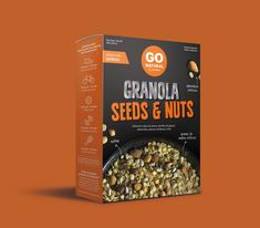 a box of granola seeds and nuts on an orange background