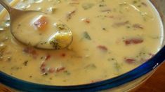 a bowl filled with soup on top of a wooden table