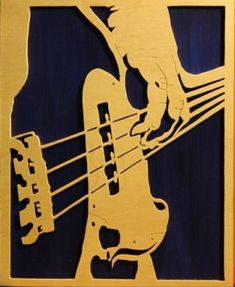 a wooden plaque with an image of a bass player and guitar strings inlayed to it