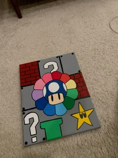 an image of a game on the floor with question mark and mario mushroom in it