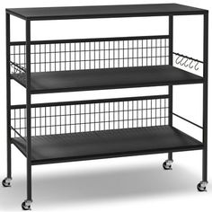 three tiered metal shelf with wire baskets on the top and bottom shelves, black