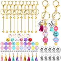 a bunch of different types of key chains with tassels and charms on them