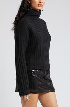 Wide ribbing lends cozy texture to this woolly sweater that's sure to be on heavy rotation in the cooler seasons. 21" length (size Medium) Funnel neck Long sleeves 55% cotton, 26% polyester, 11% nylon, 5% wool, 3% spandex Hand wash, dry flat Imported Black Ribbed Cashmere Top, Ribbed Cropped Sweater In Relaxed Fit For Fall, Ribbed Relaxed Fit Cropped Sweater For Fall, Winter Cashmere Sweater With Ribbed Neckline, Winter Ribbed Turtleneck Knit Top, Black Ribbed Collar Cropped Sweater For Fall, Black Cropped Sweater With Ribbed Collar For Fall, Winter Wool Tops With Ribbed Neckline, Winter Wool Sweater With Ribbed Neckline