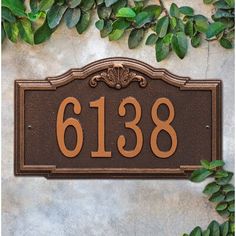 the address sign for 618 is surrounded by green leaves