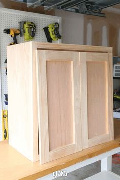 Wooden DIY Projects for Beginners Wood Working Tool Storage, Work Shop Organization Garage Workshop, Diy Cheap Cabinets, How To Build Doors For Cabinet, Diy Entertainment Center With Cabinets, Semihomemade Cabinets, Build Garage Cabinets, Diy Wood Cabinet Storage, How To Build Cupboards