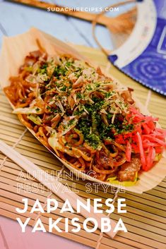 japanese yakisoba on a bamboo mat with chopsticks next to it