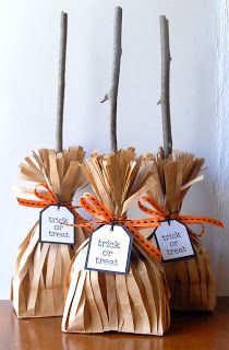 three bags with tags tied to them sitting on a table