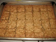 a pan filled with food sitting on top of a counter