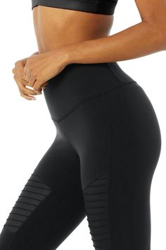 Meet the slightly cropped version of our practice-to-pavement fave—perfect for petites and for pairing with sneakers. The patented 7/8 High-Waist Moto Legging has the same sculpting and contouring fit and feel, with mixed matte/shine fabric and forward mesh paneling. A true power player, on and off the mat. Sculpts, lifts & smooths! Cool, moto-inspired contouring pintucks & mesh cutouts Designed & uniquely fit to flatter every size Wear-tested by our in-house team for the perfect fit 7/8 High-Wa Moto Leggings, Inhale Exhale, Alo Yoga, Pin Tucks, Shiva, Black Leggings, Sport Fitness, High Waist, Perfect Fit