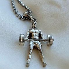 Product Description: Introducing our Bodybuilding Fitness Man Pendant made from high-quality Sterling Silver. Featuring a muscular bodybuilder, this pendant is designed for the gym junkies who love fitness and bodybuilding. This handmade item is minimalist in style, perfect for those who prefer simple yet classy accessories. Highlights: - Handmade item from Greece 🇬🇷  - Minimalist style design - Made from high-quality sterling silver Benefits: This stunning Bodybuilding Fitness Man Pendant is Greece Minimalist, Silver Benefits, Classy Accessories, Love Fitness, Bodybuilding Fitness, Bodybuilding Workouts, Minimalist Style, Style Design, Mens Fitness