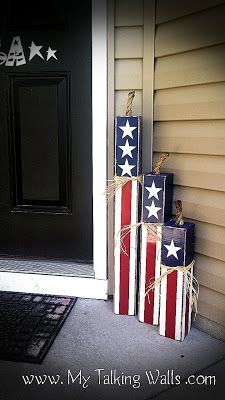 three patriotic boxes are stacked on the front porch for display and to be used as decorations