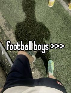 the shadow of a person sitting in front of a glass window with text reading football boys