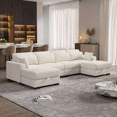 a living room filled with furniture and a large white couch in front of a window