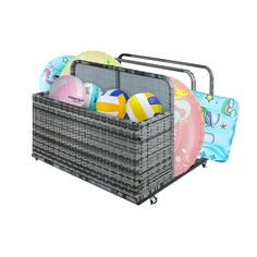 a gray basket filled with beach balls on top of a white background