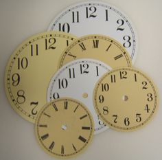 four clocks with numbers on each side of them