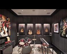 a music room with guitars and drums on the wall