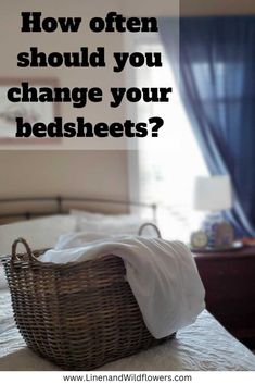 a wicker basket sitting on top of a bed with the words how often should you change your bedsheets?