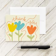 a thank you card with colorful flowers and the words, thank you written on it