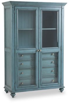 an armoire with drawers and doors on the front, in blue painted wood finish