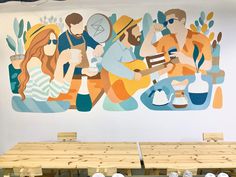 a mural on the wall of a restaurant with people sitting at wooden tables and chairs