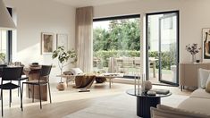 a living room filled with furniture and a dining table next to a sliding glass door