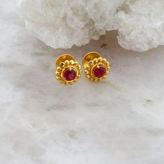 22K Yellow Gold Synthetic Ruby Ear Studs, round 4.5 mm faceted center with gold bead halo, modern handmade, screw backs, .4 inch across, 2.8 grams Stock # BB533BAM04 This listing contains photographs of the actual item you will receive. Our items are in excellent condition with little or no signs of wear and many are one of a kind pre-owned estate finds. Please look closely at the pictures in this listing as they are part of the product description. Please read the description, as any imperfecti Ear Drop Earrings, Ruby Earrings Studs Gold, 4 Grams Gold Ear Rings, Chand Bali Earrings Gold, 2 Grams Gold Earrings Designs, Opal Moon Necklace, Gold Earrings For Kids, Ear Tops, 22k Gold Earrings