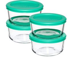 set of three glass storage containers with green lids and lids on each one, shown from the front