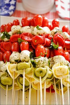 several skewers filled with different types of veggies