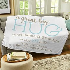 a personalized blanket that says, a great big hug to grandma and grandpa