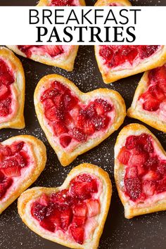 heart shaped strawberry shortbreads on a plate with strawberries