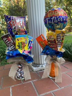 two vases filled with candy and balloons