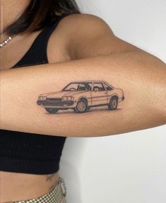 a woman with a car tattoo on her arm