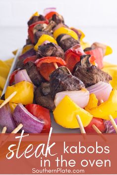 steak kabobs on skewers with peppers and onions