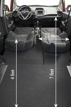 the interior of a small car with seats in it and measurements for each seat height