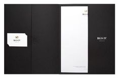 an open black book with white paper on the front and back pages, featuring a logo for boast