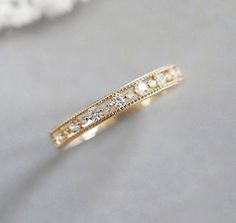 a gold ring with diamonds on it