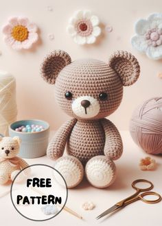 a crocheted teddy bear sitting next to a yarn ball and scissors with the caption free pattern