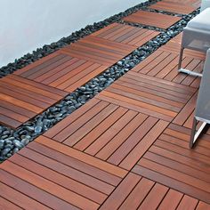 a wooden floor next to a white chair