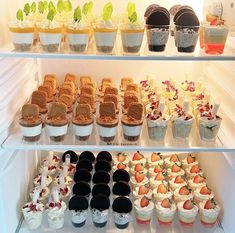 a refrigerator filled with lots of different types of desserts