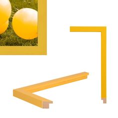 two yellow balls sitting on top of a green field next to a pair of poles