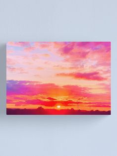 the sun is setting over an orange and pink sky canvas print on wall art paper