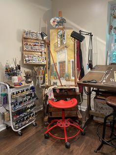 an artist's studio with various art supplies on display