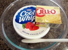 yogurt and cereal are in a bowl on the counter