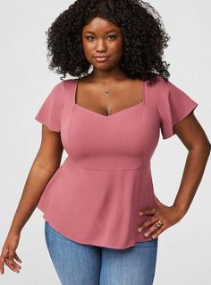 FIT Model is 5'10” wearing size 1. . Measures 28” from shoulder (size 2). MATERIALS + CARE Challis woven fabric: New, improved, and loved by all—and still lightweight, drapey, and (really! ) machine-washable. . Stretch level: None. . 82% rayon, 18% polyester. Machine wash cold. Line dry. Imported. DETAILS Sweetheart neckline. Short sleeves. Peplum detail. The best plus size women's peplum sweetheart top tops in wild ginger made of washchallis. Torrid is your destination for cozy fall and winter Clothing For Plus Size Women, Sweetheart Top, Wild Ginger, New Street Style, Shoes For Leggings, Pretty Blouses, Peplum Styles, Flutter Sleeve Top, Beautiful Blouses