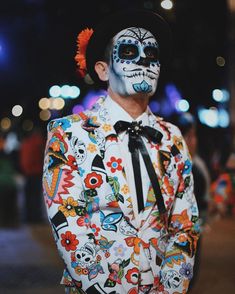 a man with painted face and body art