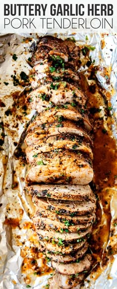 grilled chicken breast on foil with garlic and parsley in the background text reads, buttery garlic herb pork tenderion