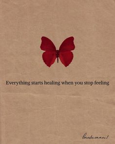 a red butterfly sitting on top of a piece of paper with the words, everything starts when you stop feeling